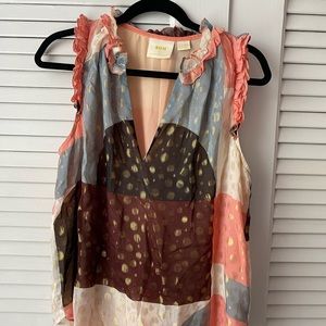 Gold polka dot ruffled sleeve tank top blouse.